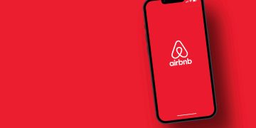 Airbnb,App,On,Smartphone,Screen,With,Large,Shadow,Giving,The